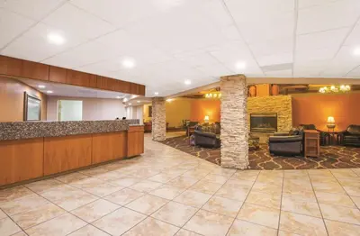 a large lobby with couches and a fireplace at Mountain Valley Inn & Suites in Silverthorne