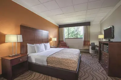 a hotel room with a bed and a television at Mountain Valley Inn & Suites in Silverthorne