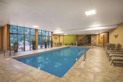 a large swimming pool in a hotel room at Mountain Valley Inn & Suites in Silverthorne