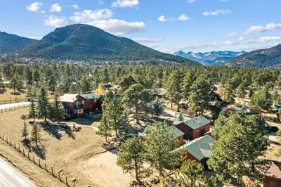 an aerial view of a home in the mountains at Mountain Shadows Resort in Estes Park