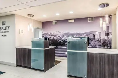 a lobby with two refrigerators in front of a counter at Quality Inn & Suites Westminster - Broomfield in Westminster
