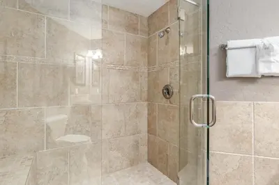 a bathroom with a shower with a glass door at Mount Cirrus 10B Condo in Estes Park