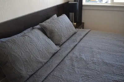 a bed with two pillows on top of it at Stone Mountain Lodge in Lyons