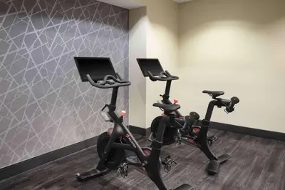 two exercise bikes in a room with a wall at Homewood Suites- Denver Downtown Convention Center in Denver