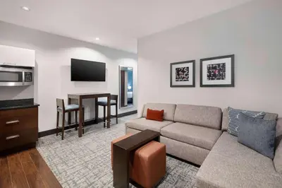 a living room with a couch and a table at Homewood Suites- Denver Downtown Convention Center in Denver