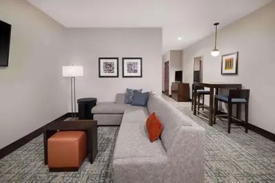 a living room with a couch and a table at Homewood Suites- Denver Downtown Convention Center in Denver