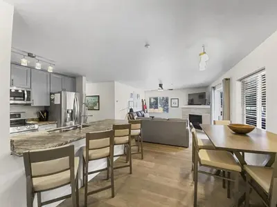 a kitchen and dining room with a table and chairs at Swans Nest Villa 1601 Condo in Breckenridge