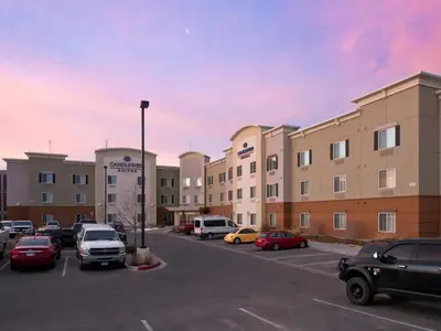 a parking lot with cars parked in front of a building at Candlewood Suites Greeley by IHG in Greeley