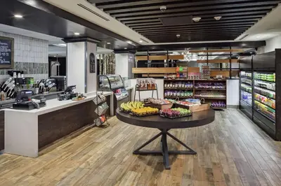 a grocery store with a counter with bananas on a table at DoubleTree by Hilton Hotel Denver in Denver