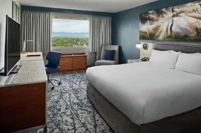 a hotel room with a large bed and a window at DoubleTree by Hilton Hotel Denver in Denver