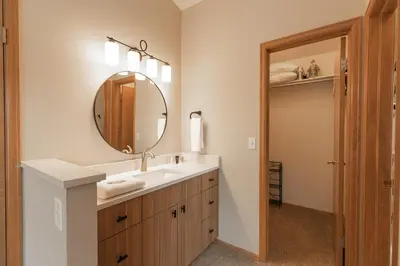 a bathroom with a sink and a mirror at Solitude Station Home: Walk to Downtown in Frisco