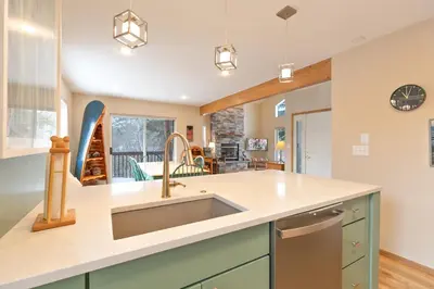 a kitchen with a sink and a counter top at Solitude Station Home: Walk to Downtown in Frisco