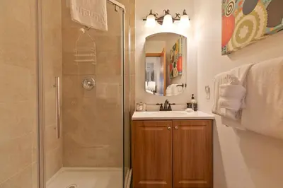 a bathroom with a shower and a sink at Lagoon Royal Townhome: Mountain Views Meet Modern Comforts in Frisco