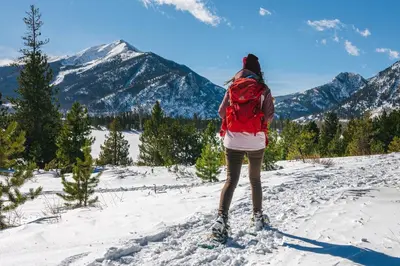 a person on skis in the snow with mountains at Lagoon Royal Townhome: Mountain Views Meet Modern Comforts in Frisco