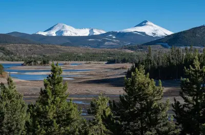 a view of snow covered mountains with trees at Lake Forest Shoreview Condo: Fantastic Views in Frisco