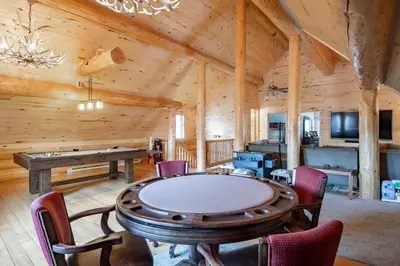 a room with a ping pong table in a log cabin at Elk Meadow Lodge: Luxury Log Home, Hot Tub in Breckenridge
