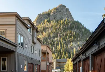 a mountain in the background of a town with houses at Frisco Sports Chalet Tenmile Condo: Stylish, On Shuttle Route in Frisco