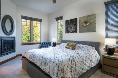 a bedroom with a bed and a fireplace at Frisco Sports Chalet Tenmile Condo: Stylish, On Shuttle Route in Frisco
