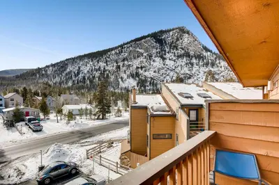 a view of a snowy mountain from a balcony at Cedar Lodge Peak One Studio Condo: Downtown Frisco in Frisco