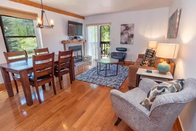 a living room with a table and a dining room at Mountainside Peakview Condo: Cool Location, Updates in Frisco