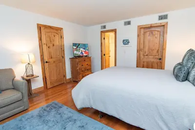 a bedroom with a bed and a couch and a chair at Mountainside Peakview Condo: Cool Location, Updates in Frisco