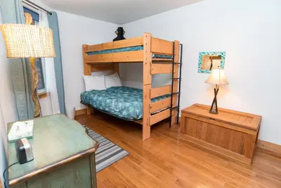 a bedroom with a bunk bed with a cat sitting on top at Mountainside Peakview Condo: Cool Location, Updates in Frisco