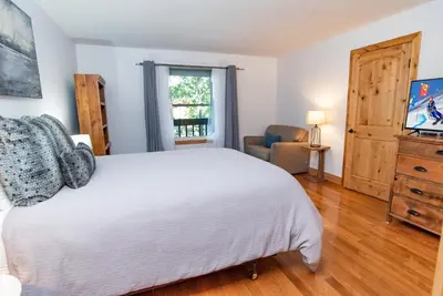 a bedroom with a white bed and a window at Mountainside Peakview Condo: Cool Location, Updates in Frisco