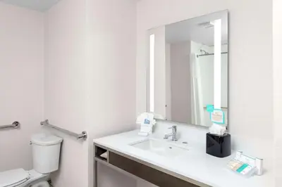 a bathroom with a sink and a mirror at Hilton Garden Inn Denver/Thornton in Thornton