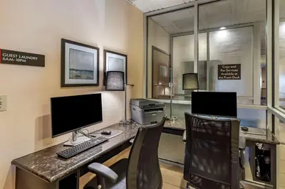an office with two desks with a computer and two chairs at Best Western Brighton Inn in Brighton