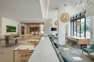a lobby with tables and chairs and a cafeteria at Element Denver Downtown East in Denver