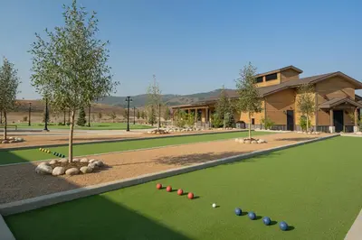 a golf course with a tree and balls on it at Sun Outdoors Rocky Mountains in Granby