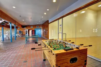 a large room with a foosball table and a ping at Timber Ridge Retreat in Silverthorne