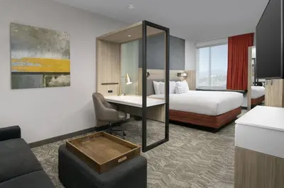 a hotel room with a bed and a desk at SpringHill Suites by Marriott Loveland Fort Collins/Windsor in Windsor