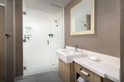 a bathroom with a sink and a shower at SpringHill Suites by Marriott Loveland Fort Collins/Windsor in Windsor