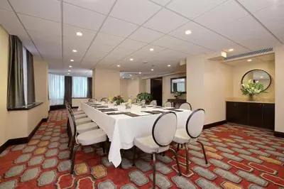 a large conference room with a long table and chairs at Holiday Inn Express Denver Downtown by IHG in Denver