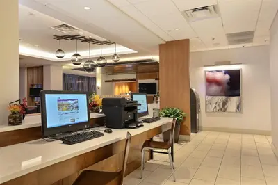 an office with a desk with a computer on it at Holiday Inn Express Denver Downtown by IHG in Denver