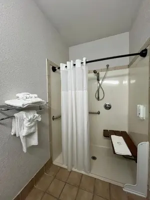 a bathroom with a shower with a shower curtain at Quality Inn & Suites Loveland in Loveland