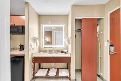 a bathroom with a sink and a mirror at Comfort Suites Lakewood - Denver in Lakewood