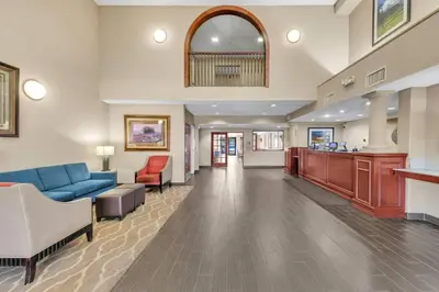 a lobby of a hospital with a blue couch and chairs at Comfort Suites Lakewood - Denver in Lakewood