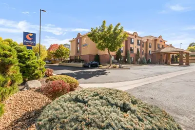 a view of a building with a parking lot at Comfort Suites Lakewood - Denver in Lakewood