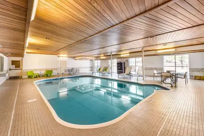 a large swimming pool in a hotel room at Quality Inn & Suites University Fort Collins in Fort Collins