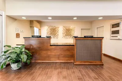 a lobby with a reception desk in a building at Quality Inn & Suites University Fort Collins in Fort Collins