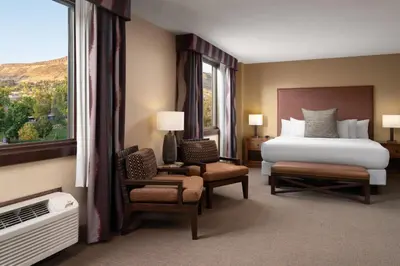 a hotel room with a bed and a window at The Golden Hotel, an Ascend Collection Hotel in Golden