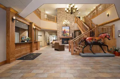 a statue of a horse in the middle of a lobby at The Golden Hotel, an Ascend Collection Hotel in Golden