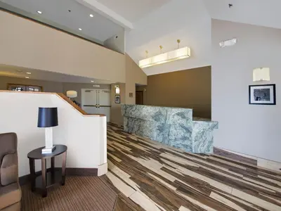 a lobby of a hospital with a waiting room at Baymont by Wyndham Fort Collins in Fort Collins