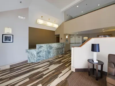 a lobby of a hospital with a waiting room at Baymont by Wyndham Fort Collins in Fort Collins