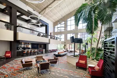 a lobby of a hospital with chairs and tables at DoubleTree by Hilton Denver Tech in Greenwood Village