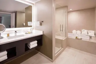 a bathroom with a sink and a shower at DoubleTree by Hilton Denver Tech in Greenwood Village