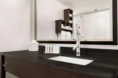 a bathroom with a sink and a mirror at Hampton Inn Denver-West/Golden in Golden