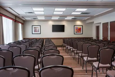 a conference room with chairs and a flat screen tv at Hampton Inn Denver-West/Golden in Golden